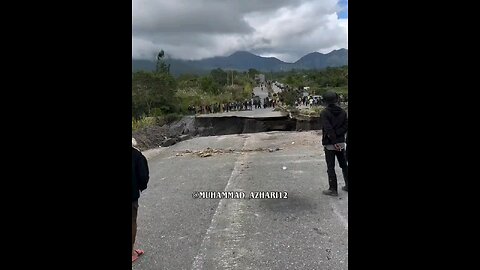 A road in Indonesia collapsed after heavy flooding and landslides.