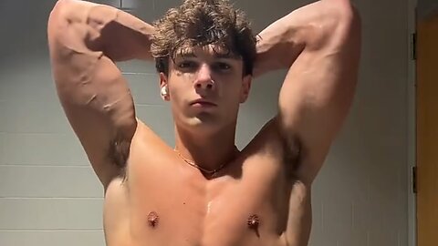 Young Aesthetic bodybuilder flexing muscles