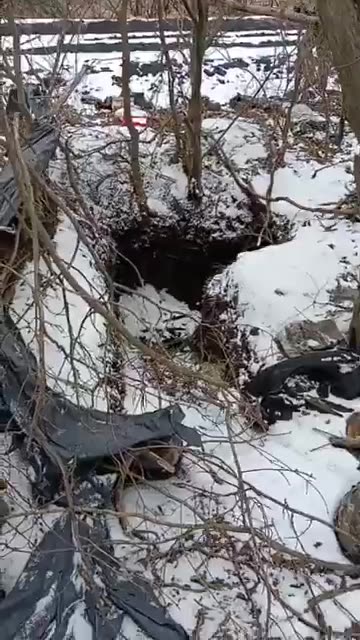 Three dead men at a captured position.