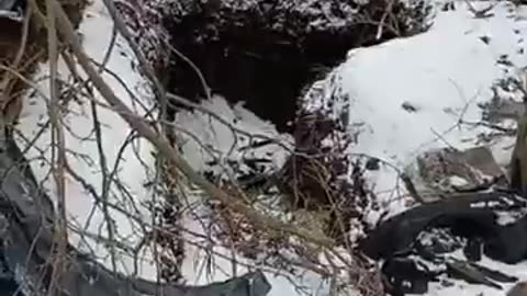 Three dead men at a captured position.