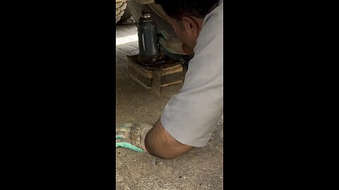 Man truck repair tire punch