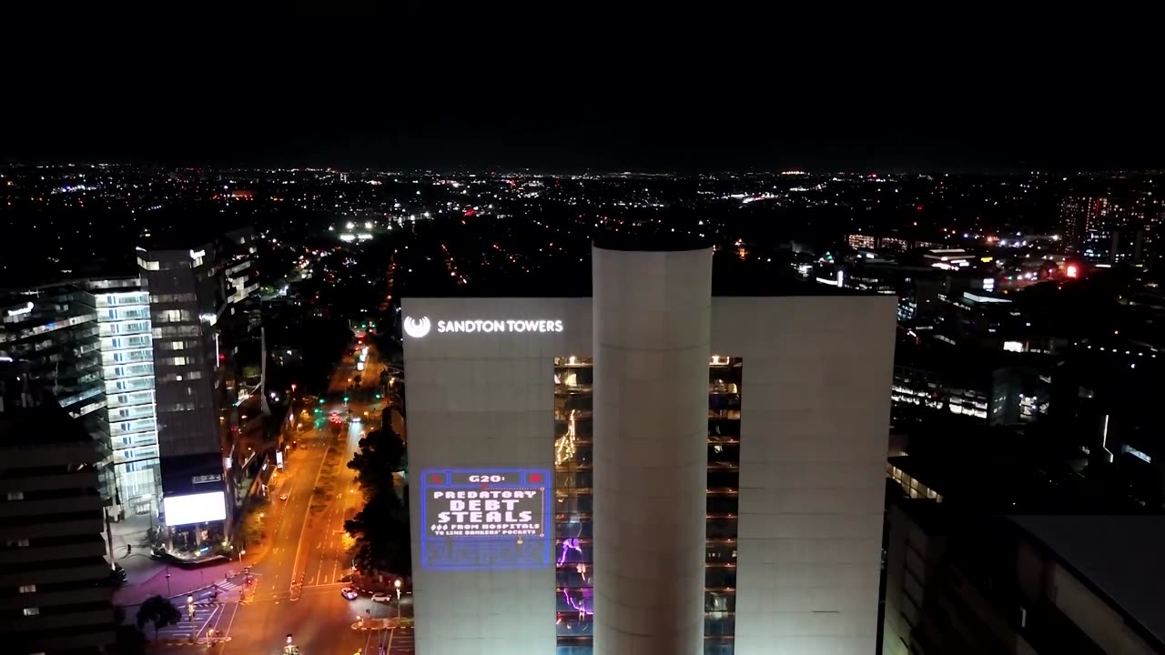 Debt justice activists light up buildings ahead of Johannesburg G20