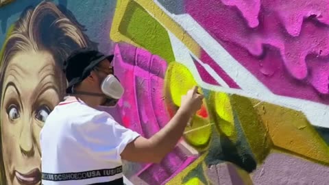 Street Artist Creating Beautiful Graffiti Art