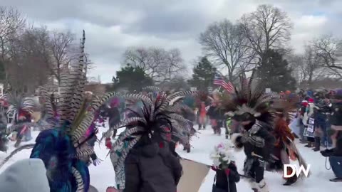 Anti-ICE protesters are waving Mexican flags and conducting a ceremony