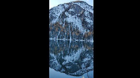 Snowy Mountains Reflected in Crystal-Clear Alpine Lake