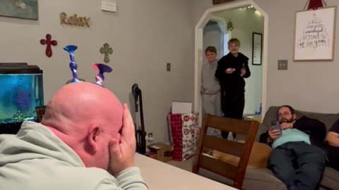 Bald Uncle Lends Target For Popdarts