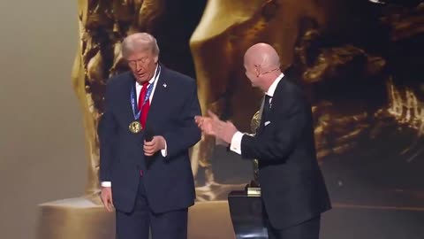 WHAT A MOMENT! FIFA President Gianni Infantino presents President Trump with