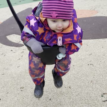 Baby Kayla Riding on the Swing — Cute Playground Moment