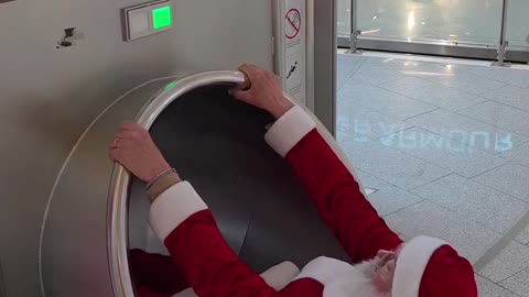 Rollerblading Santa Has Fun In Shopping Mall