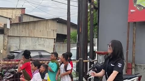 Beautiful girls dance when the tourist bus horn sounds