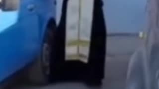 Russian Priest Windexes Holy Water Into Used Vehicles to Protect Russian Soldiers