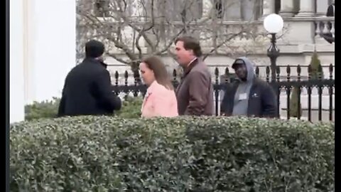 Tucker Carlson seen entering the White House