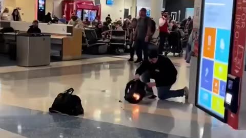 This guy’s backpack burst into flames at Dallas Airport