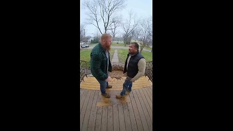 Two angry men fight on the porch