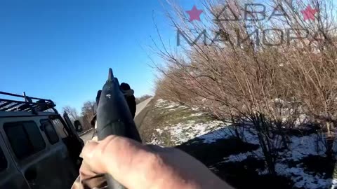 Russian soldier shooting down drone with shotgun