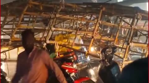 Auto Driver Cheats Death as Hoarding Crashes on Rickshaw