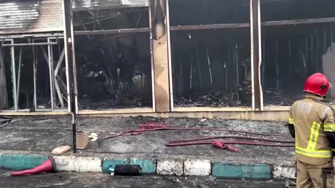 Thick smoke billows as fire engulfs shopping center in Tehran
