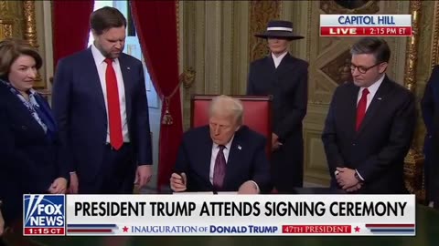 President Donald Trump signs the first executive orders of his term