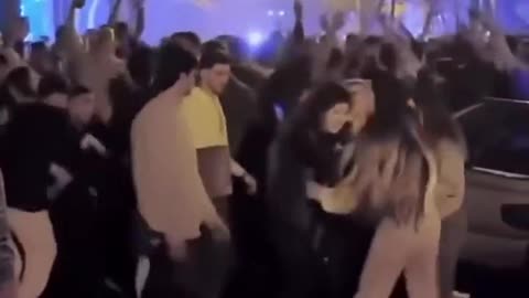 Iranian women dancing and whipping their hair around.