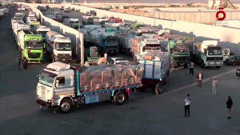 Aid trucks wait to enter Gaza at Egypt's Rafah crossing