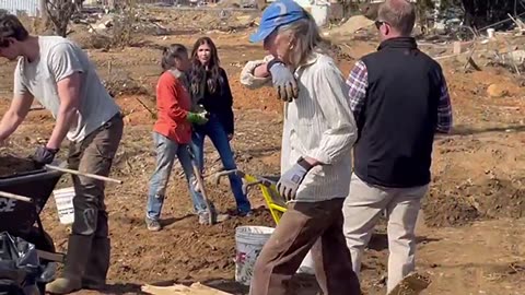 Kristi Noem cleaning up Swannanoa NC, side by side with locals.