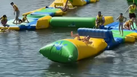 Dad Launches Daughter On Waterpark Blob