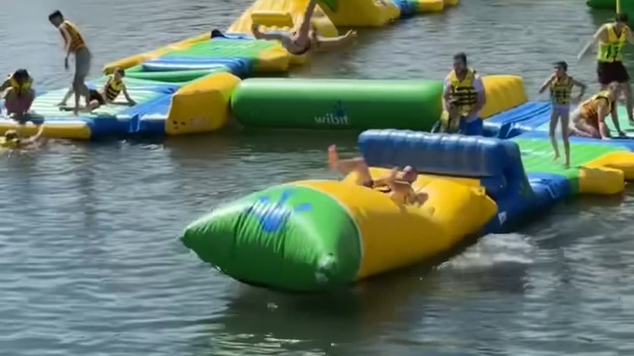 Dad Launches Daughter On Waterpark Blob