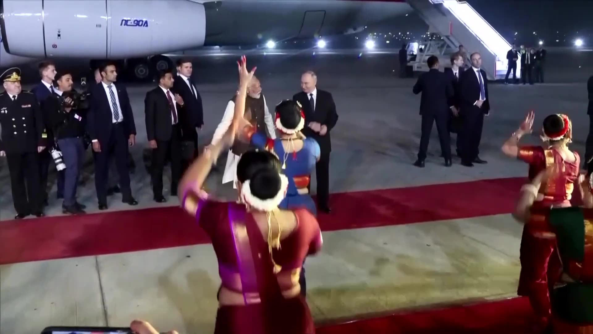 Modi greets Putin at the airport in rare gesture
