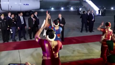 Modi greets Putin at the airport in rare gesture