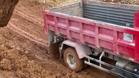 queues of trucks passing through steep roads on top of mountains