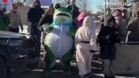 anti-ICE demonstrators sing "Kristi Noem is a bird-legged hoe” at Whipple federal building