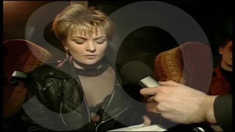 Mark Lamarr boarding a coach full of audience members just as they arrived for the show