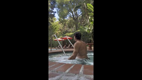 Naked, hot tub