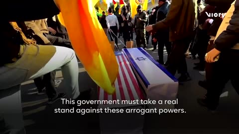 US and Israeli flags were set alight at a huge rally in support of the Iranian government in Baghdad