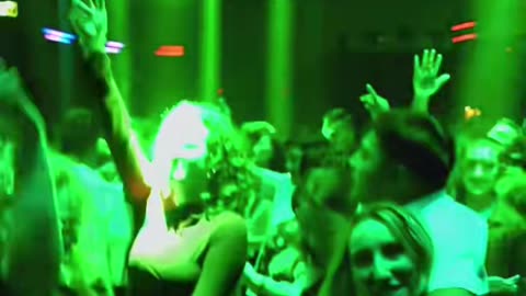 A wild party at the club with cute girls dancing to Armin van Buuren
