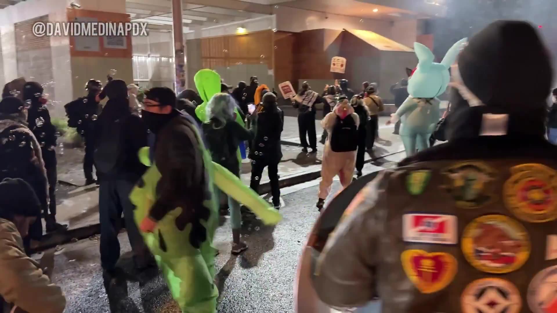 Officers deploy crowd control munitions outside of the Portland ICE facility against