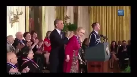 Obama giving medals to his political puppet