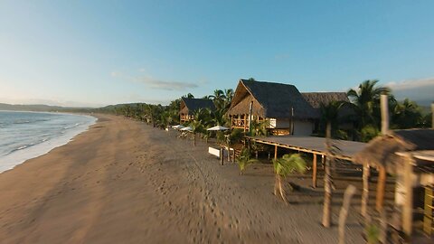 Sunny beach in a dynamic drone shot