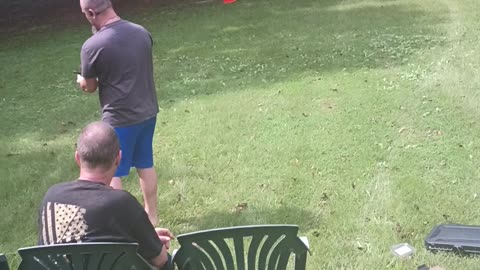 My brother with his pistol and target dummy