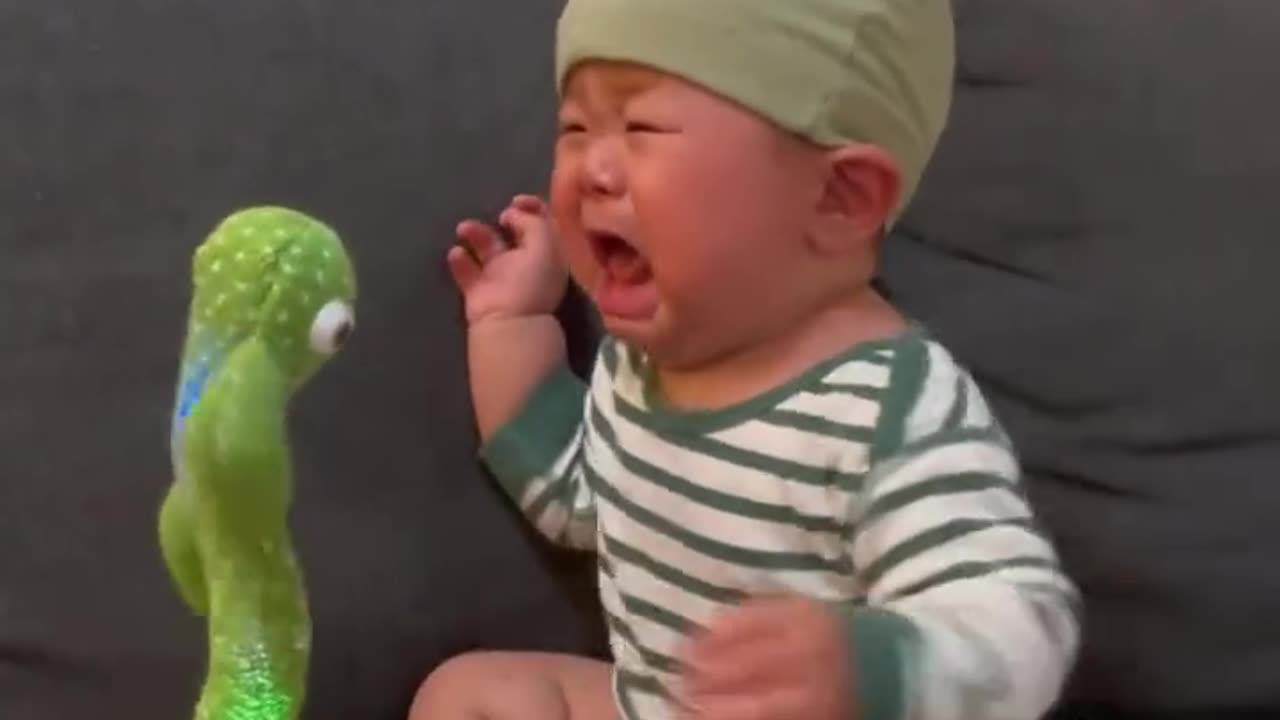 The child is scared of the toy
