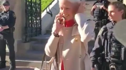 Over $12,000 in one outfit – a Gucci trench coat, Gucci handbag, and likely even a Gucci shirt.🤬