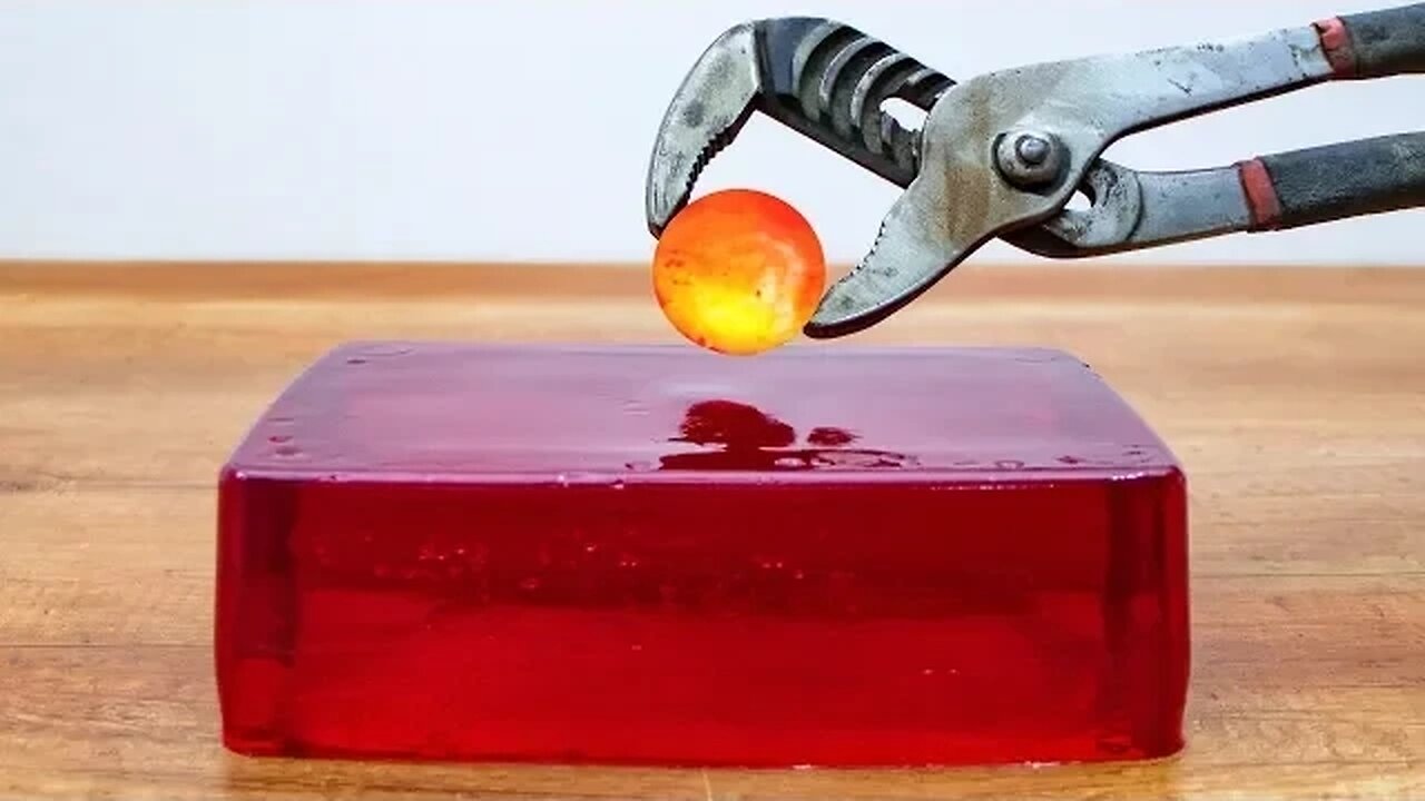 The Epic Showdown: Glowing 1000-Degree Metal Ball vs. Jelly – A Fiery Collision of Heat and Texture