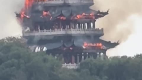 Footage shared online shows flames engulfing a pavilion at the Yongqing Temple complex in China