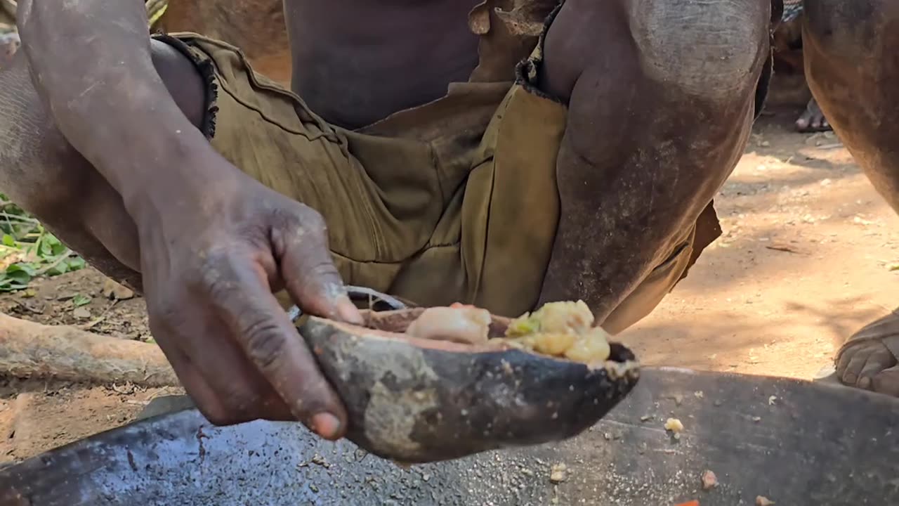 Hadzabe people enjoying baboon soup