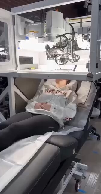 Stores in shopping malls will soon be using robots like this to insert brain chips and nano tech