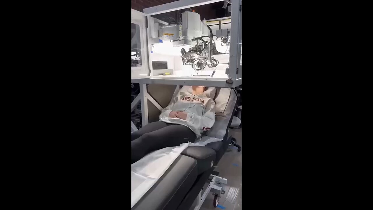 Stores in shopping malls will soon be using robots like this to insert brain chips and nano tech