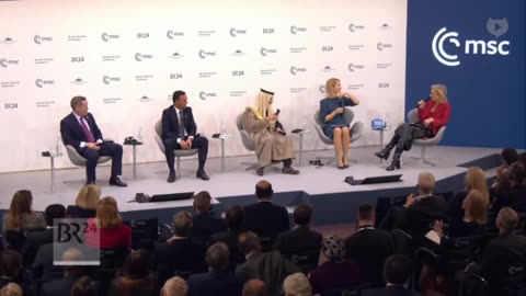 NOW - U.S. Ambassador to UN Mike Waltz presents a blue MUNGA hat at the Munich Security Conference