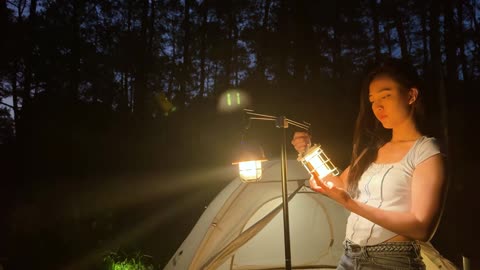 Camping with a small tent in the forest on the weekend