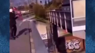 Migrants throw shopping trolley onto busy highway