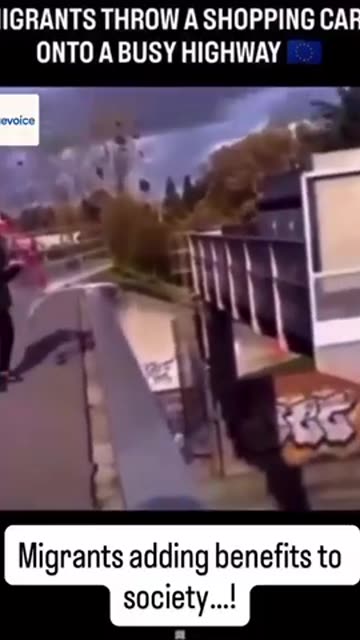 Migrants throw shopping trolley onto busy highway